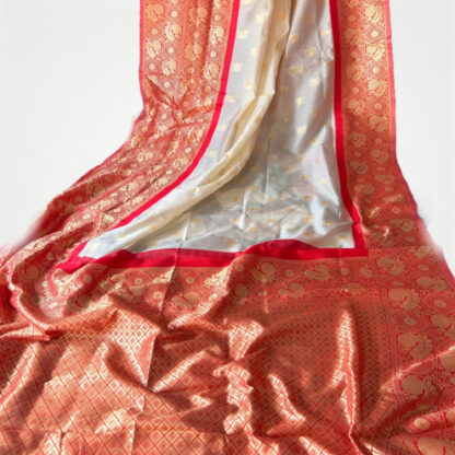 White silk saree with red hand weaving zari border